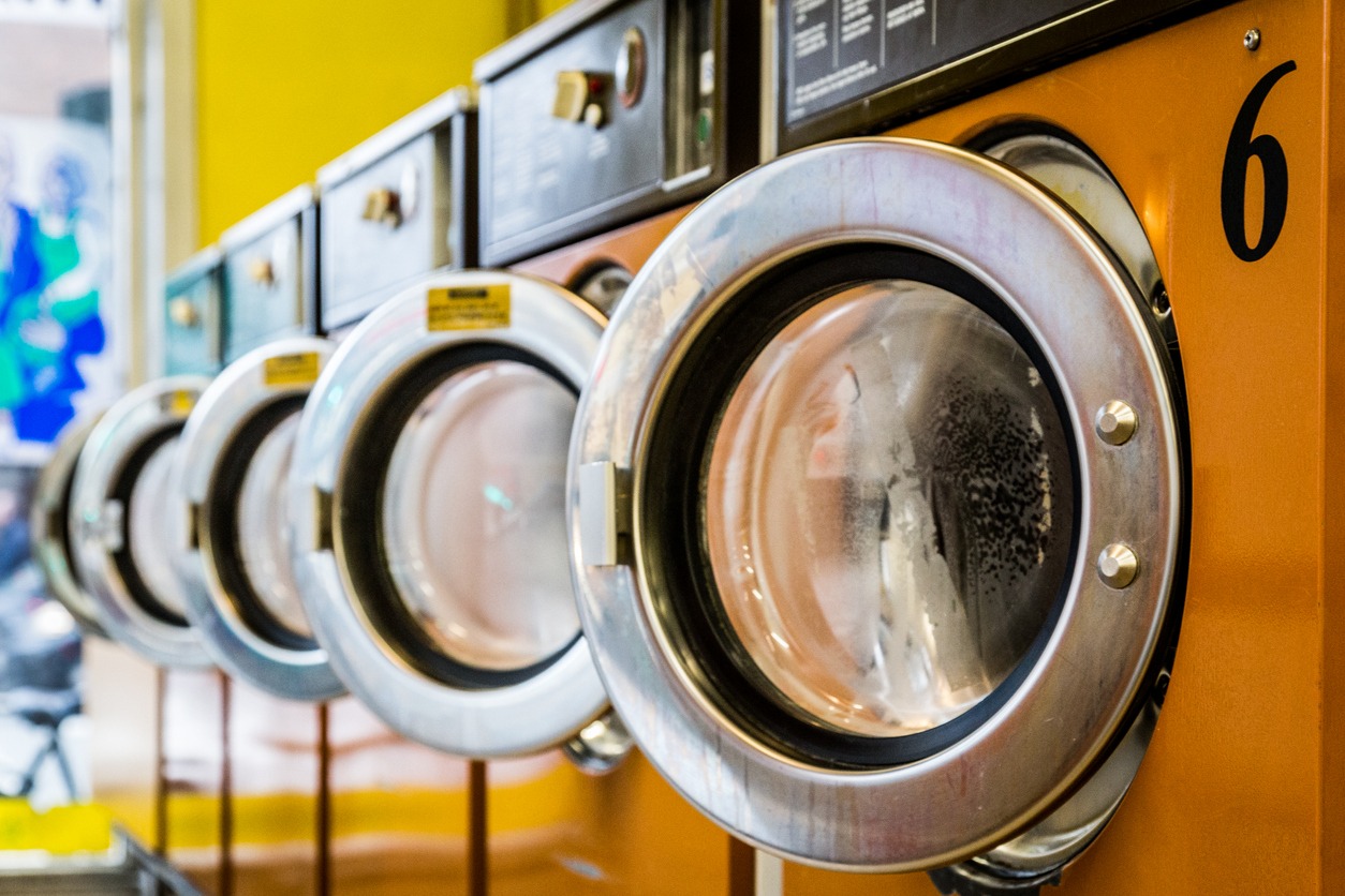 Row of washing machines in a laundromat